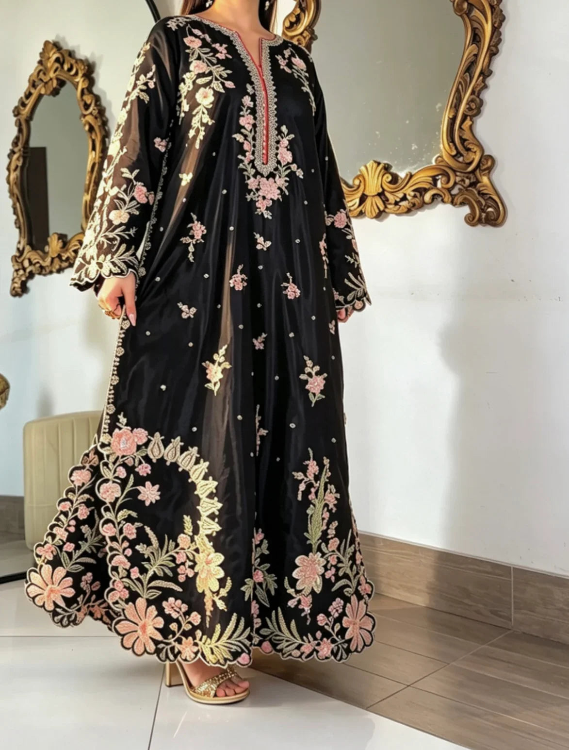 Model wearing black embroidered kaftan full length